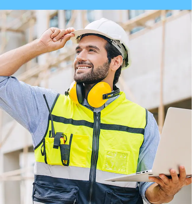 safety inspector in hard hat and worksite earmuffs