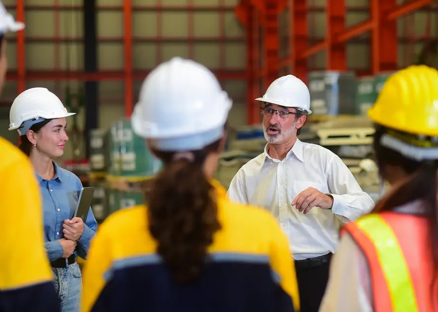 Workers with hardhats discussing plan