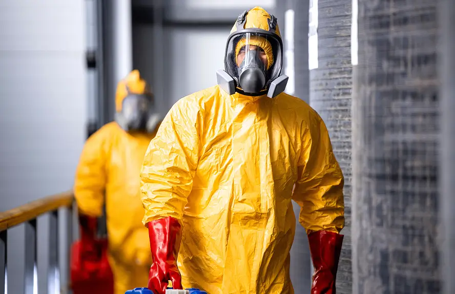 2 workers in protective suits
