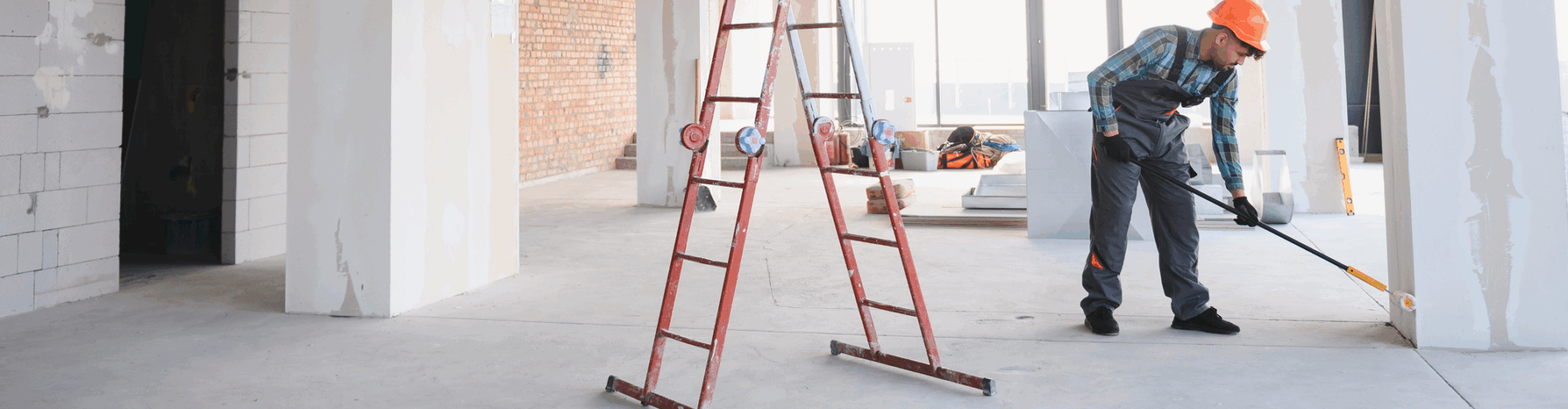 worker cleaning room