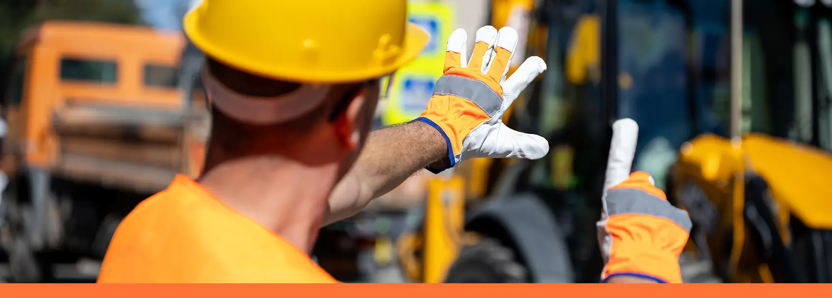behind worker holding up finger counts