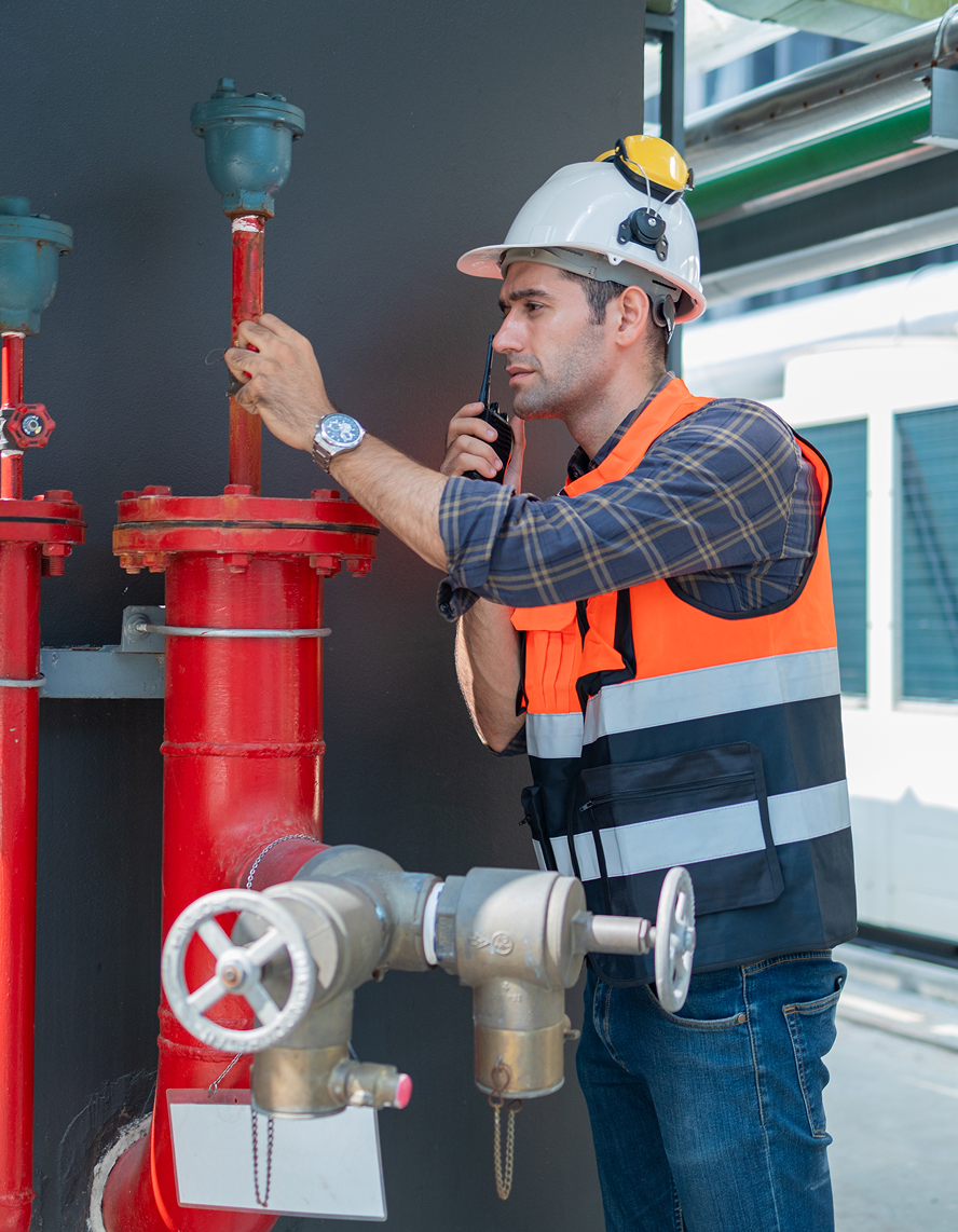 worker adjusting pipes