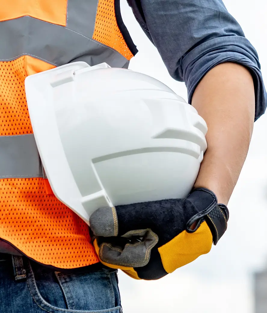 arm holding hard hat