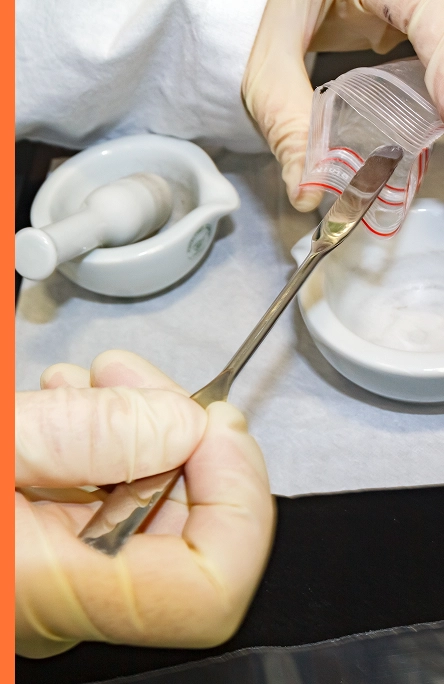 scientist testing asbestos with mortar and pestle